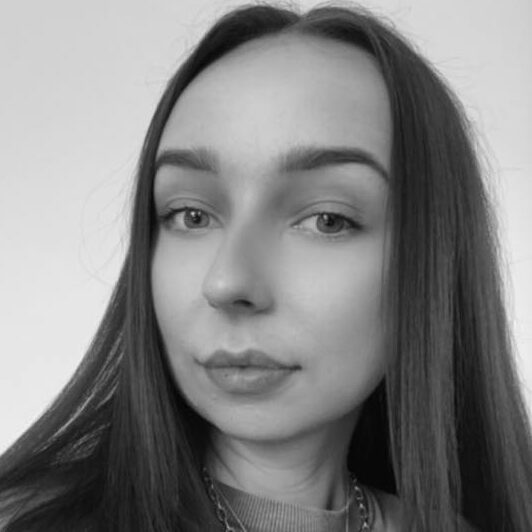 A selfie of a long haired woman in black and white